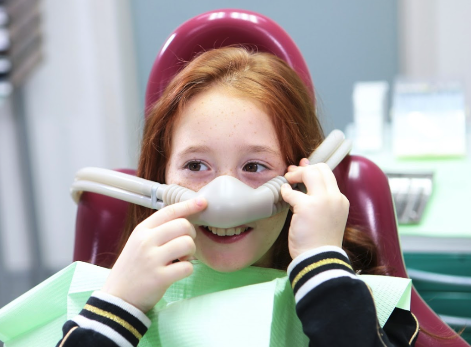A young girl getting sedated with Nitrous Oxide
